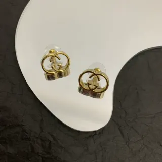 Gucci أقراط ذهبية اللون مع لوجو Double G Interlocking