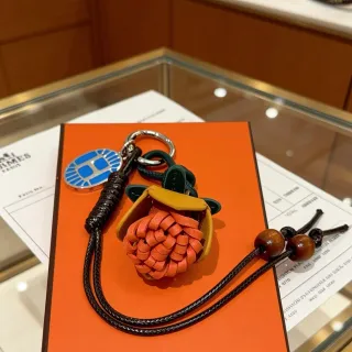 Hermès Rodeo Charm नारंगी काला बुना हुआ चमड़े का फूल ओपन-टॉप पाउच हैंडबैग
