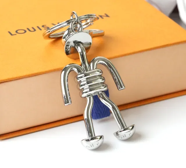 Louis Vuitton Silver Blue Polished Metal Figurine-Shaped Phone Accessory 3