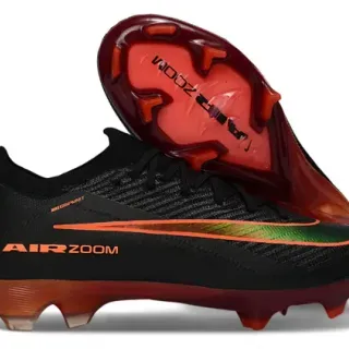 Nike Sapatos de futebol pretos e laranja com upper de malha, gola baixa, para gramado firme
