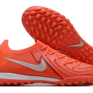Nike Sapatos de futebol turf laranja e prata low-cut upper de knit studs conicos