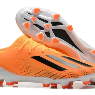 Adidas Chaussures de football basses en orange noir avec upper synthétique, lacets asymétriques pour terrain ferme