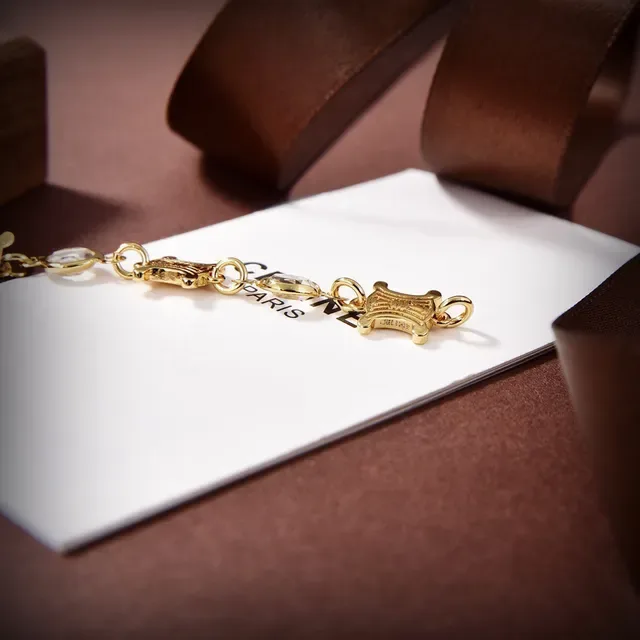 Celine Triomphe Pulsera de eslabones con piedras facetadas en tono dorado 4