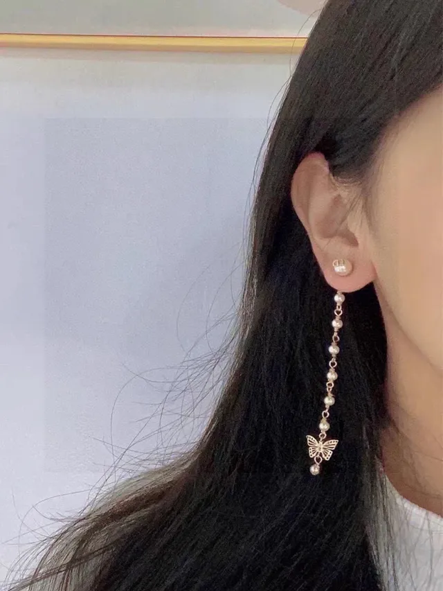 Boucles d'oreilles Dior doré perle et papillon charme goutte 7