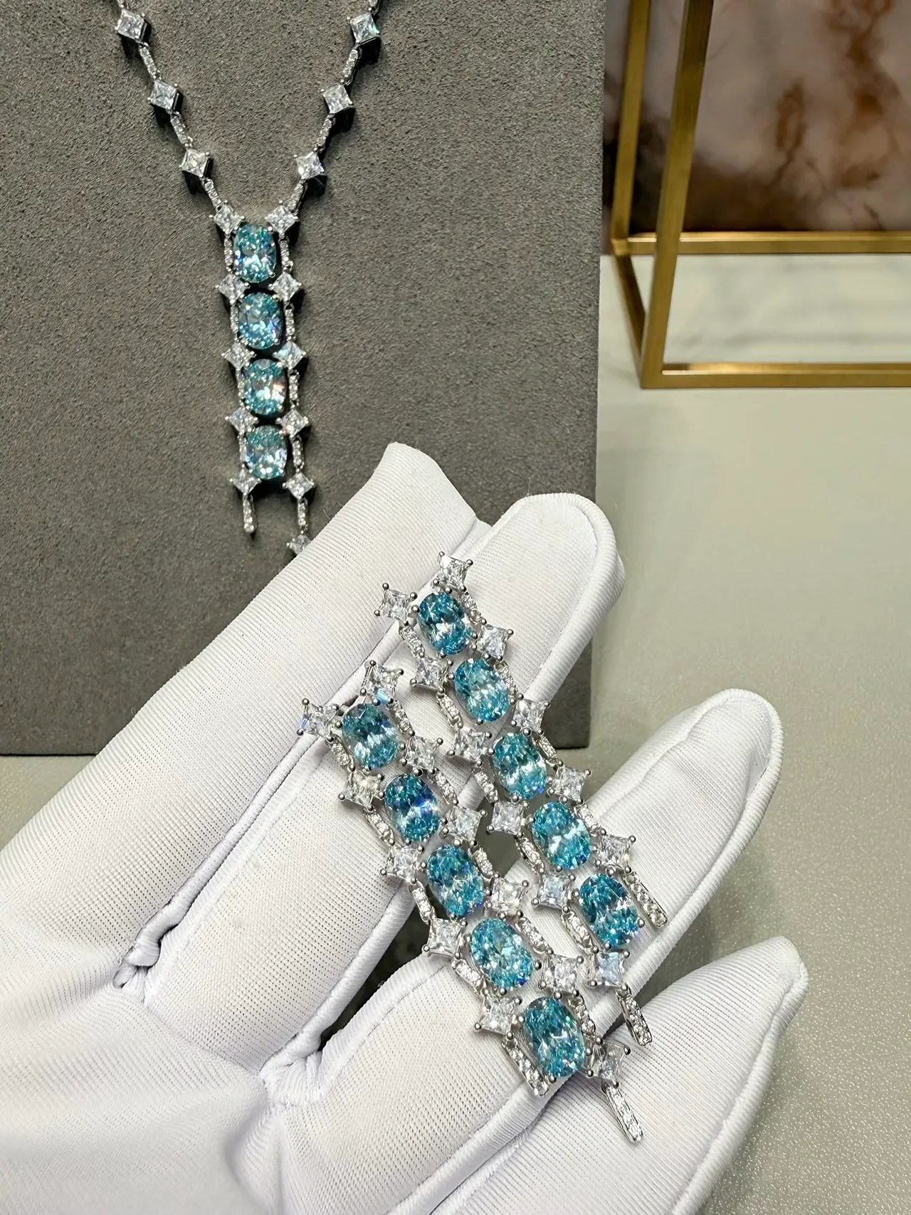 Cascading Oval Blue Gemstone and Clear Stone Drop Earrings 2