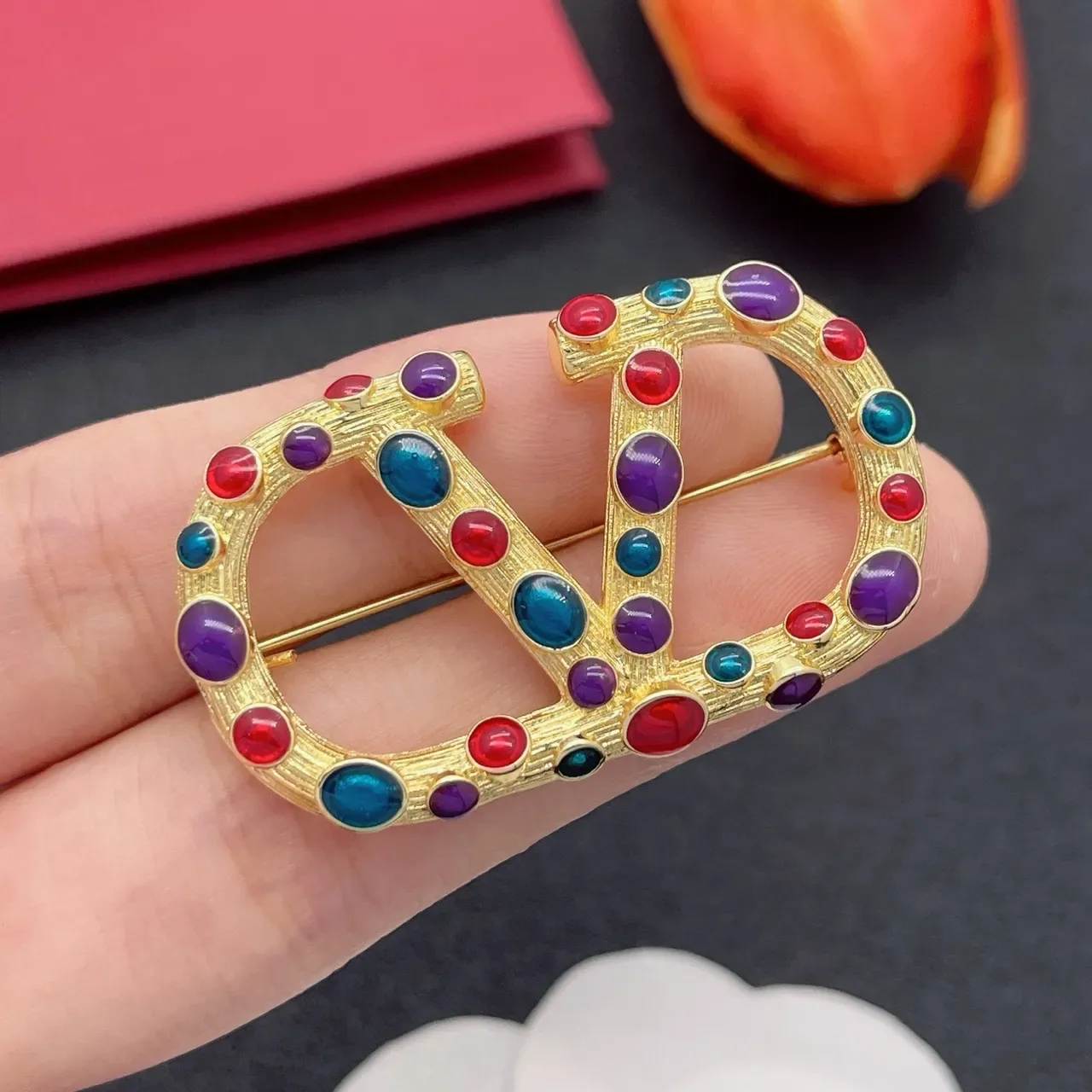 Multicolor Cabochon-Studded Interlocking C-D Motif Gold-Tone Brooch 1