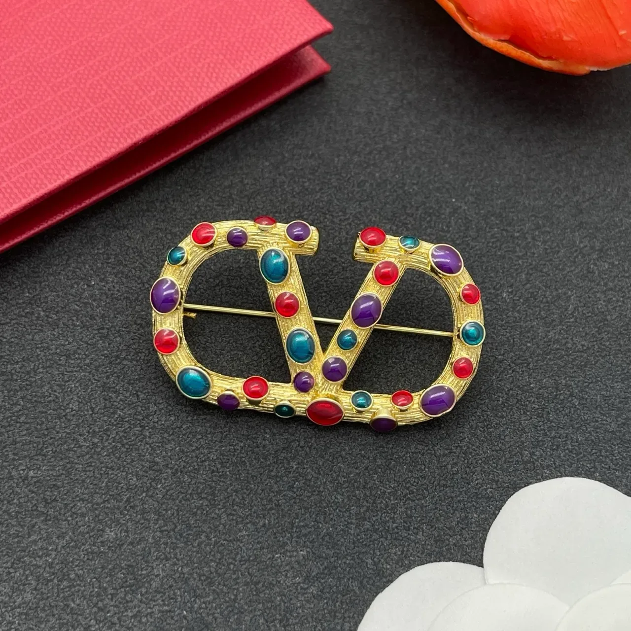 Multicolor Cabochon-Studded Interlocking C-D Motif Gold-Tone Brooch 8