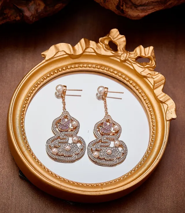 Aretes ornamentales de calabaza y pájaro con perlas y cristales 5