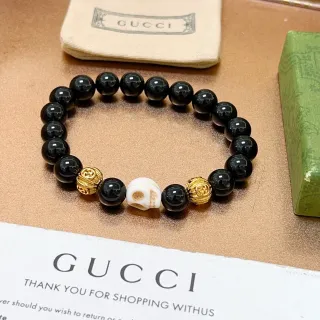 Gucci سواري أسود وذهبي مع نقش جمجمة وخرز