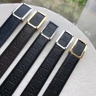Gucci Cinturón de cuero negro y dorado con motivo de G entrelazado embossado rectangular hebilla de metal