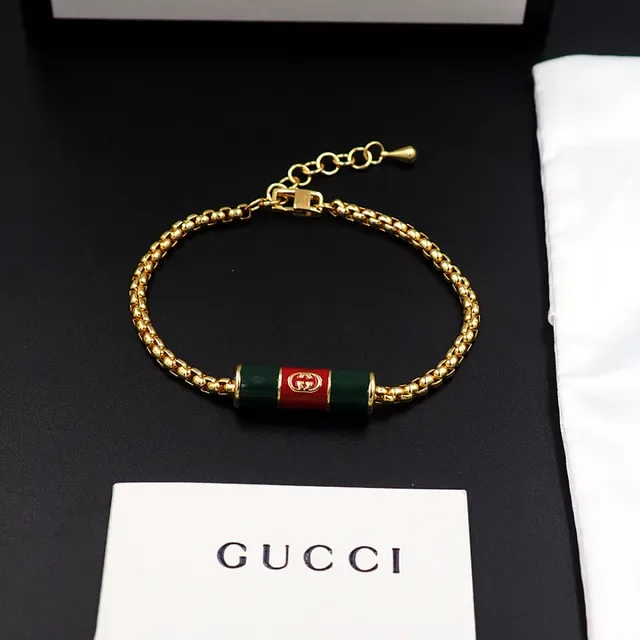 سوار تشارم Gucci بسلسلة كرب ذهبية حمراء وتعليقة أسطوانية من المينا 6
