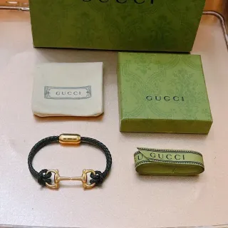 Gucci Horsebit 1955 Pulsera de cuero trenzado negro y tono dorado