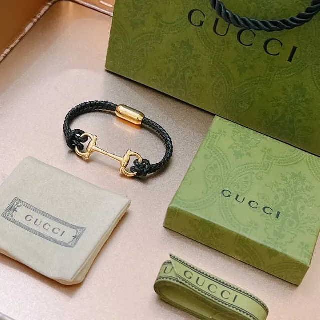 Pulseira Gucci Horsebit 1955 de couro trançado preto e dourado 4