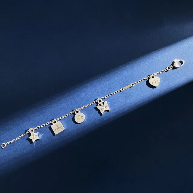 Gucci Multi-Charm Silver-Tone Engraved Logo Bracelet 4