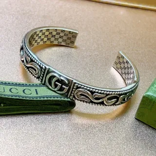 Gucci سوار فضي ذهبي ornate scrollwork interlocking GG Logo