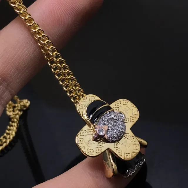 Louis Vuitton Gold Black Monogram-Engraved Clover-Shaped Necklace 2