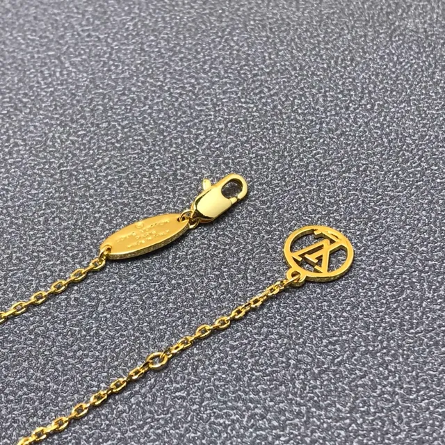 Louis Vuitton Tiger Lock color dorado mate esmaltado ojo de zafiro collar 6