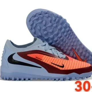 Nike Chuteiras de futebol turf azul e laranja low-cut com upper knit e sintético