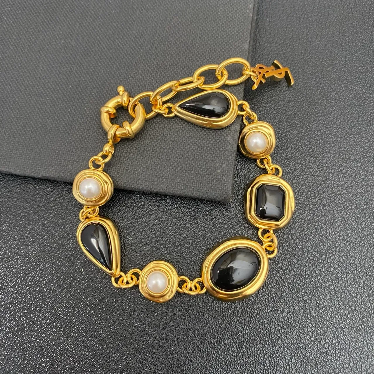 Saint Laurent Gold-Tone Black Stone and Pearl Link Bracelet 6