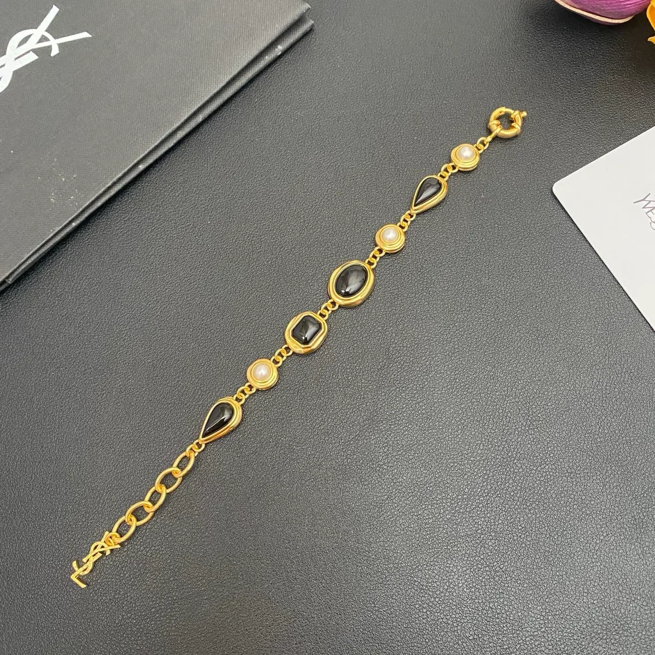 Saint Laurent Gold-Tone Black Stone and Pearl Link Bracelet 7