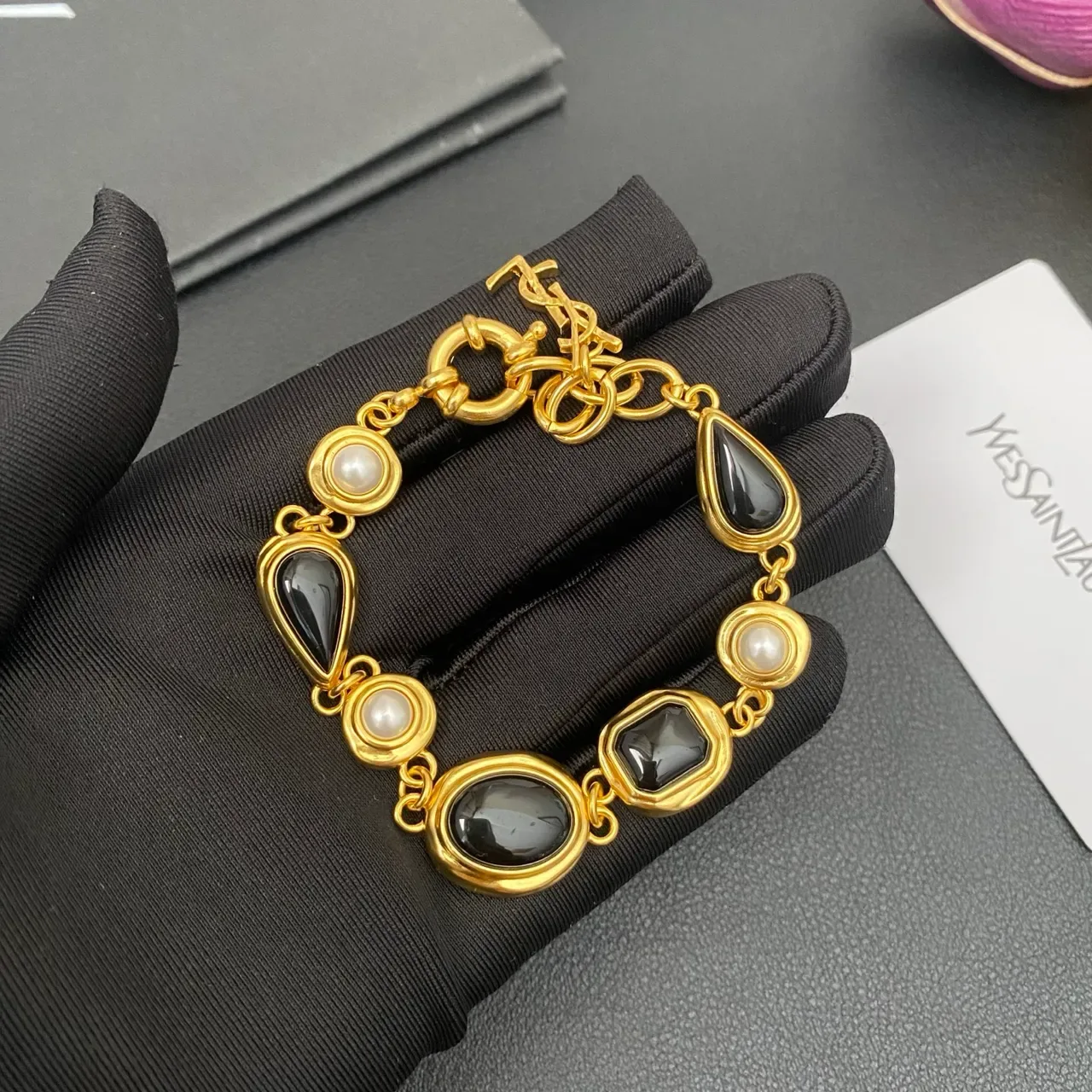Saint Laurent Gold-Tone Black Stone and Pearl Link Bracelet 8