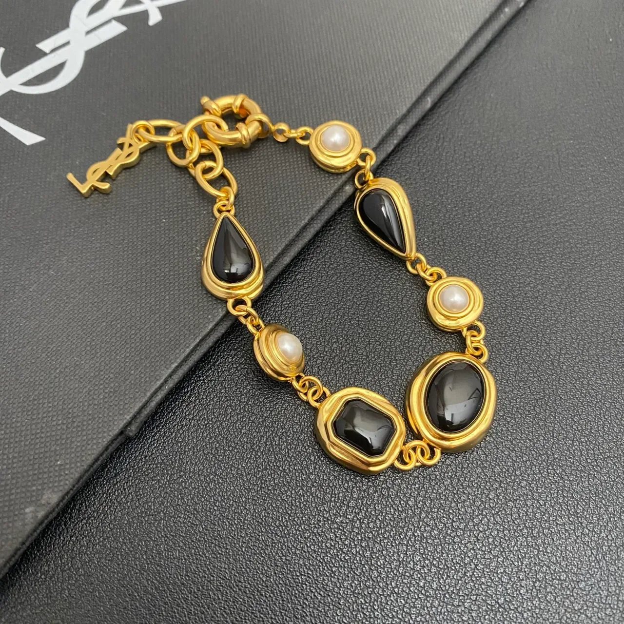 Saint Laurent Gold-Tone Black Stone and Pearl Link Bracelet 9