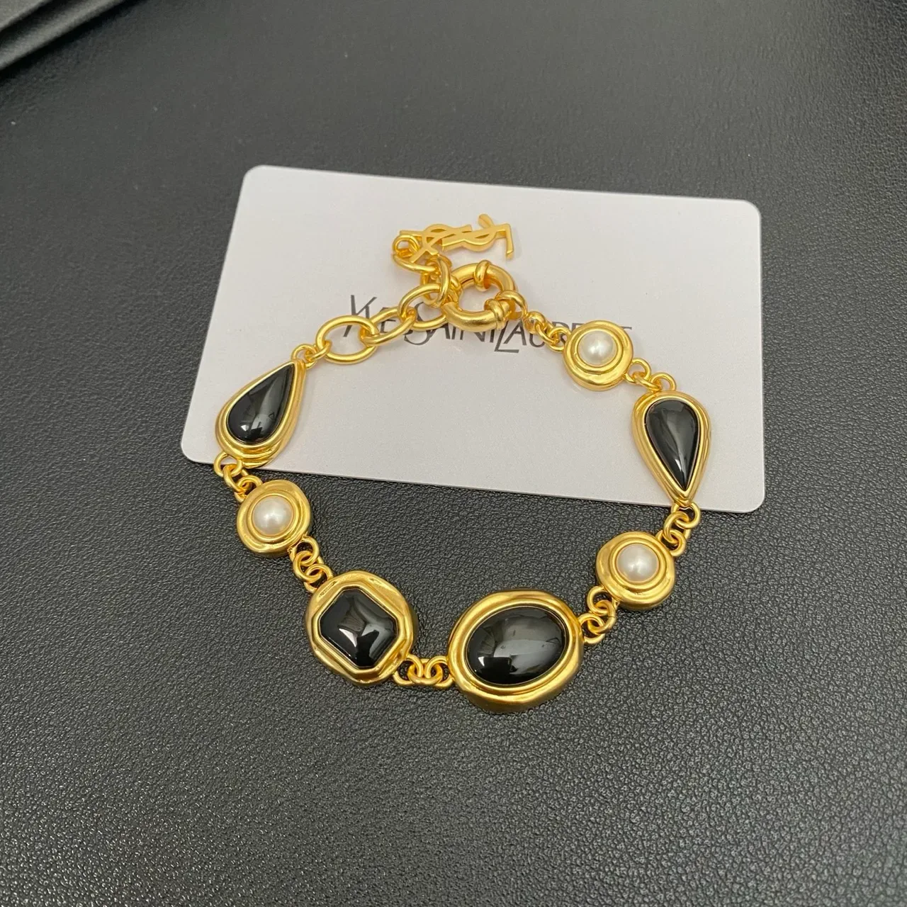 Saint Laurent Gold-Tone Black Stone and Pearl Link Bracelet 10