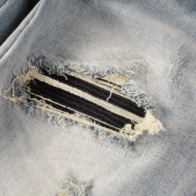 Amiri Logo Distressed Light-Wash Slim-Fit Jeans 2