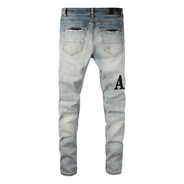 Amiri Logo Distressed Light-Wash Slim-Fit Jeans 8