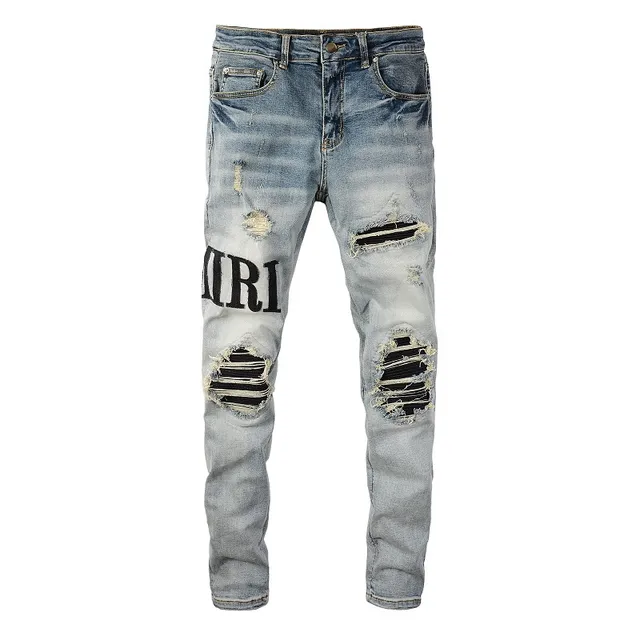 Amiri Logo Distressed Light-Wash Slim-Fit Jeans 9