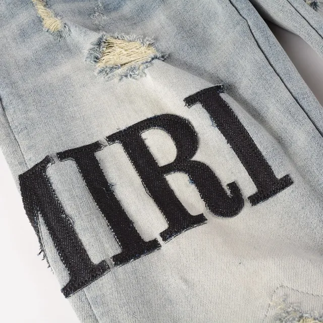 Amiri Logo Distressed Light-Wash Slim-Fit Jeans 19
