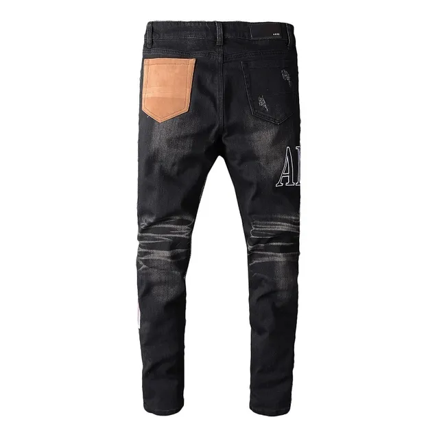 Amiri Patchwork Distressed Logo Jeans Preto 2