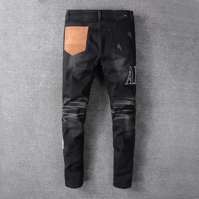Amiri Patchwork Distressed Logo Jeans Preto 3