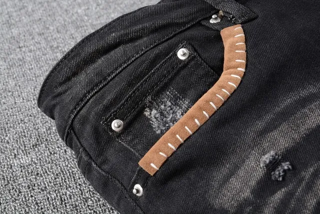 Amiri Patchwork Distressed Logo Jeans Preto 5