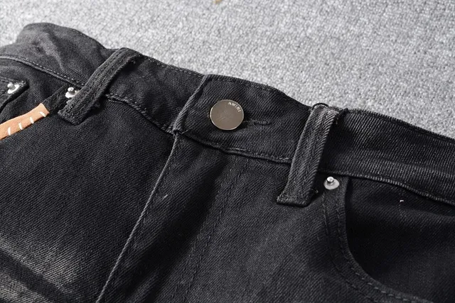 Amiri Patchwork Distressed Logo Jeans Preto 9