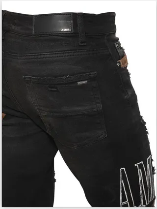 Amiri Patchwork Distressed Logo Jeans Preto 13