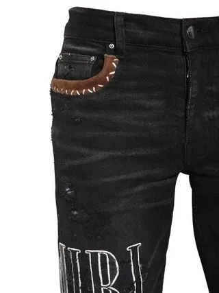 Amiri Patchwork Distressed Logo Jeans Preto 15