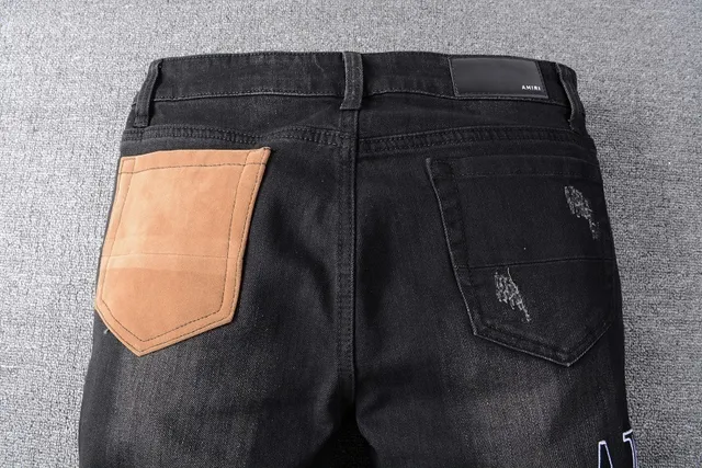 Amiri Patchwork Distressed Logo Jeans Preto 23