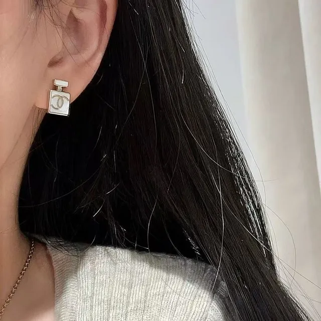 Chanel Perfume Bottle White Silver Silhouette Enamel Finish Earrings 8