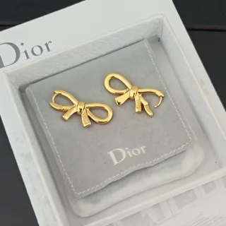 Dior Bow ذهبي رمادي ظلية إنهاء معدني مصقول أقراط