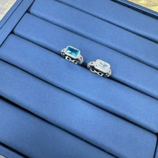 خاتم هالو حجر مركزي قطع زمرد مستطيل فضي أزرق ماس باڤيه