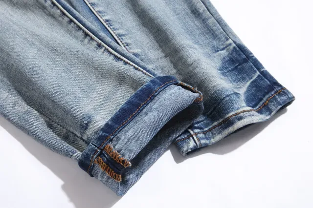 بناطيل جينز أزرق ممزقة مفتوحة الفتق مع قصة slim-tapered 7