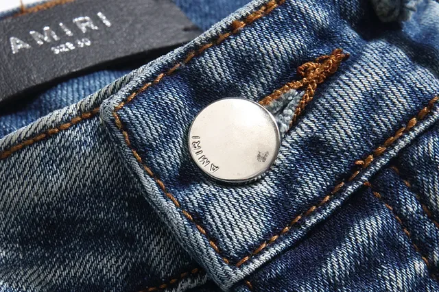بناطيل جينز أزرق ممزقة مفتوحة الفتق مع قصة slim-tapered 9