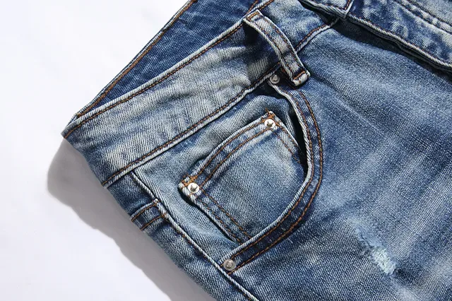 بناطيل جينز أزرق ممزقة مفتوحة الفتق مع قصة slim-tapered 10