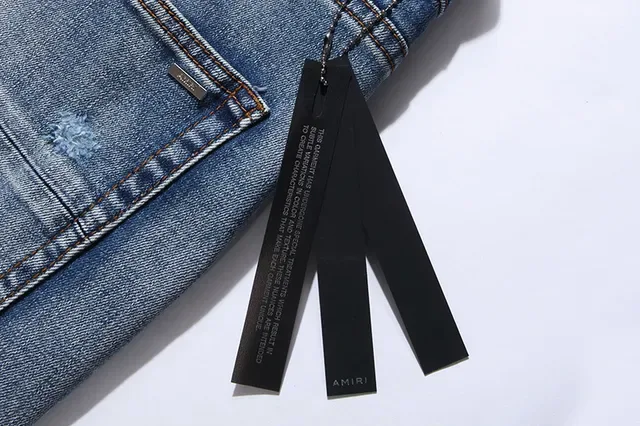 بناطيل جينز أزرق ممزقة مفتوحة الفتق مع قصة slim-tapered 12