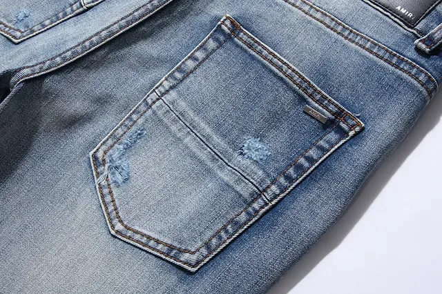 بناطيل جينز أزرق ممزقة مفتوحة الفتق مع قصة slim-tapered 13