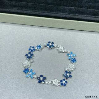Pulsera con motivo floral y estrella en azul y piedra transparente