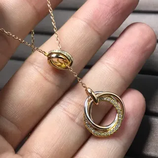 Collier pendentif double anneau entrelacé or argent pavé pierres claires