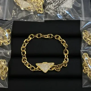 Gold-Tone Chunky Curb Chain Pavé Triangle Clasp Bracelet