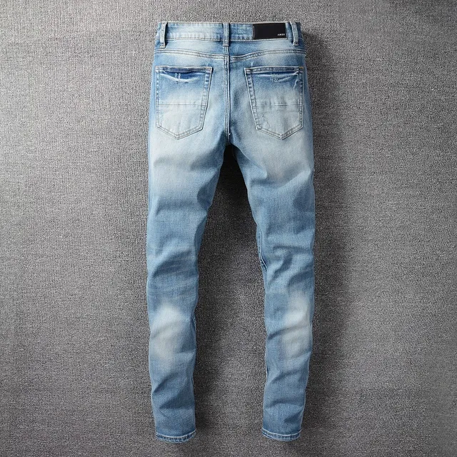 Light-Wash Distressed Slim-Fit Embroidered Patch Jeans 8